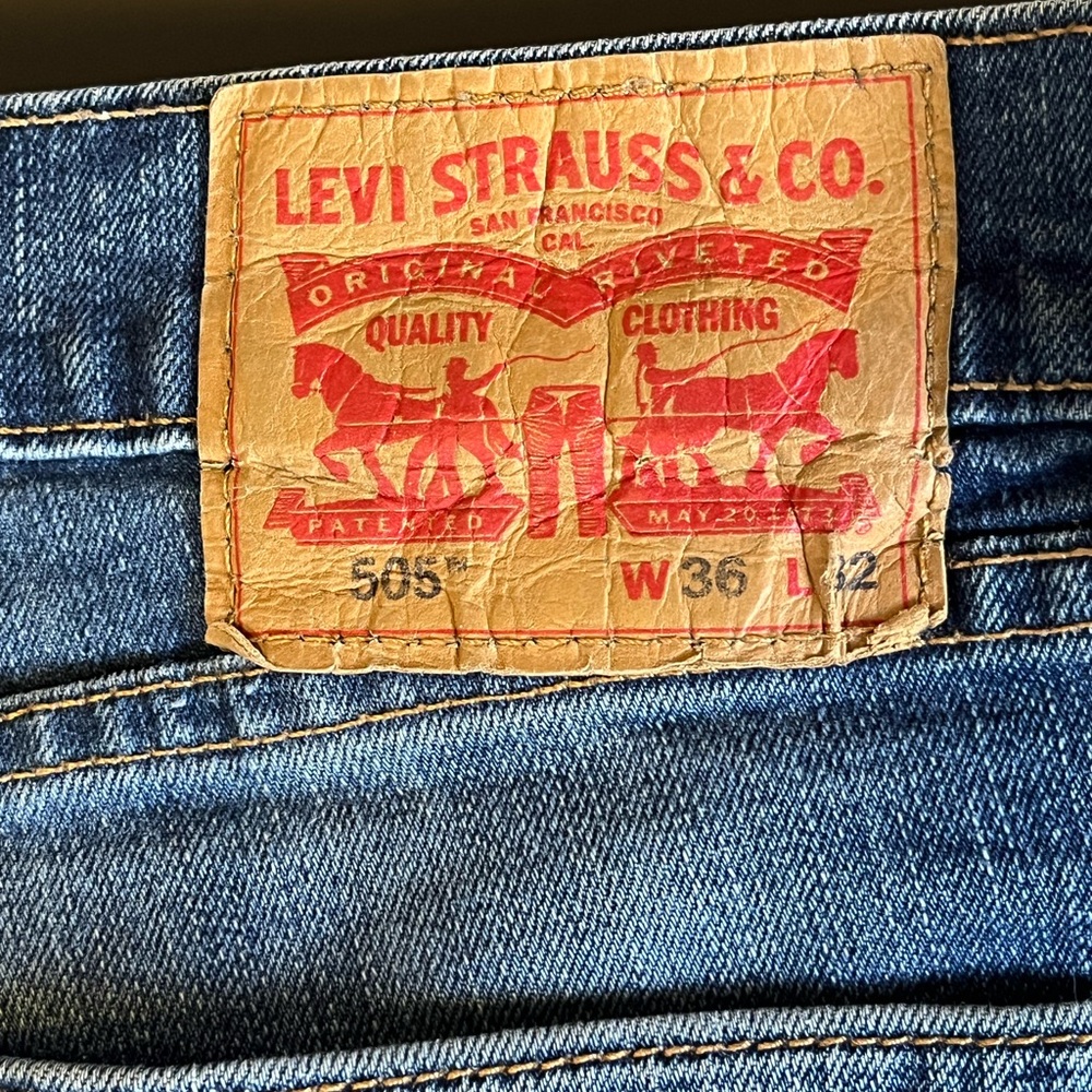 Levi’s 505 stretched and 501 original denim. All four pairs are 36X 32.